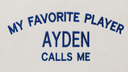 Close-up of blue embroidered text reading “My Favorite Player AYDEN Calls Me” on a white personalized Football Dad shirt.