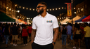 Juneteenth model/lifestyle image:
Man wearing Juneteenth Freedom 1865 T-shirt at community celebration