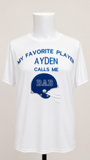 White personalized Football Dad shirt on a mannequin with AYDEN embroidered in blue and a blue football helmet appliqué featuring DAD.