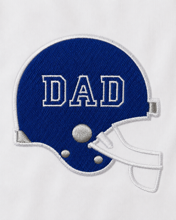 Embroidery machine stitching a blue football helmet appliqué with white details onto a personalized Football Dad shirt.